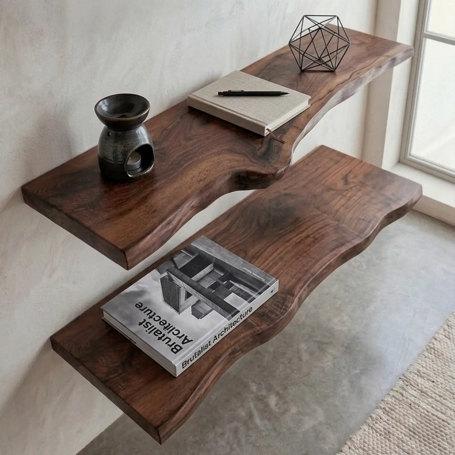 Solid wood live edge wall shelf in dark walnut finish styled with books and decor